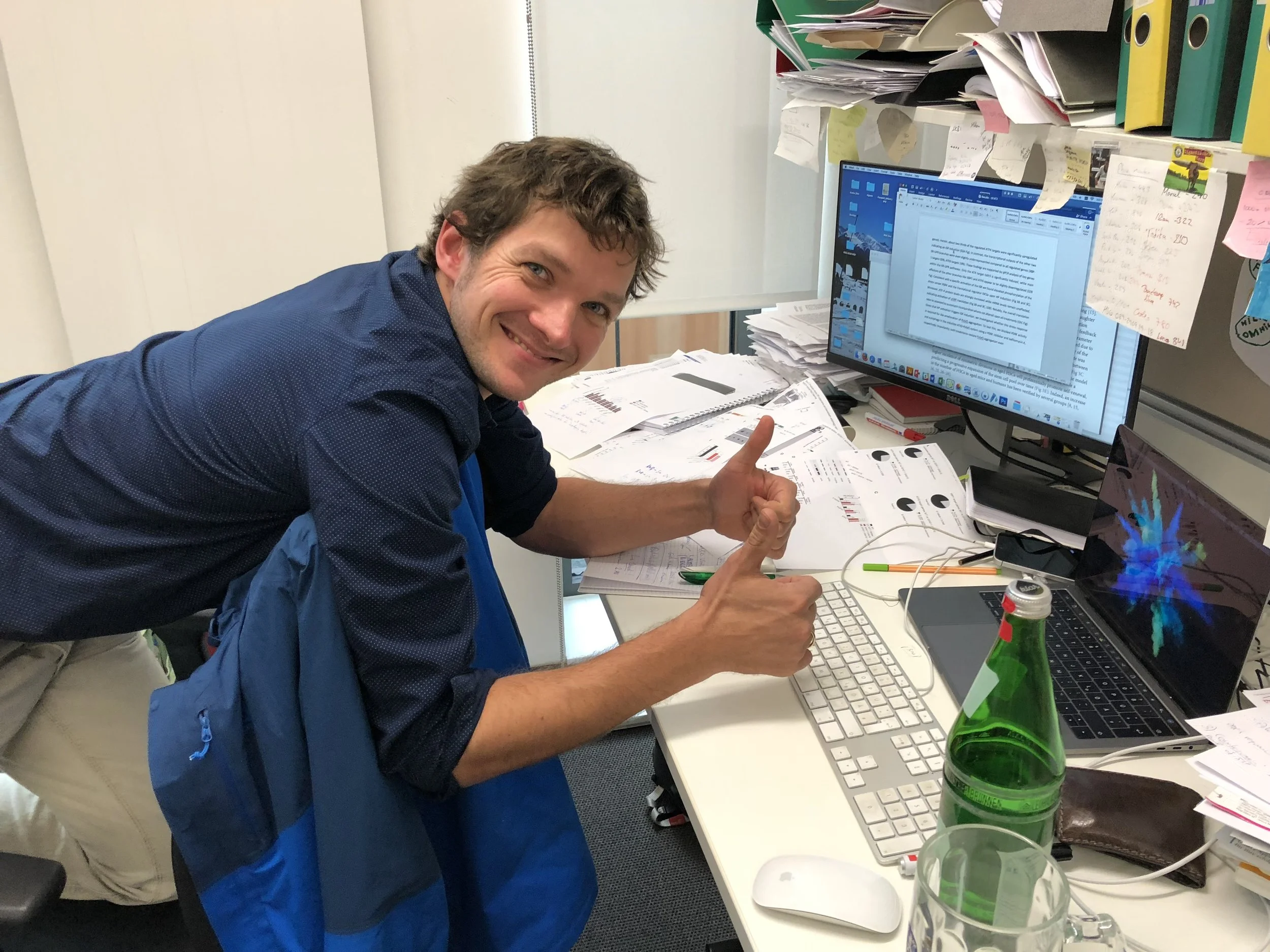 Moritz writing on his paper