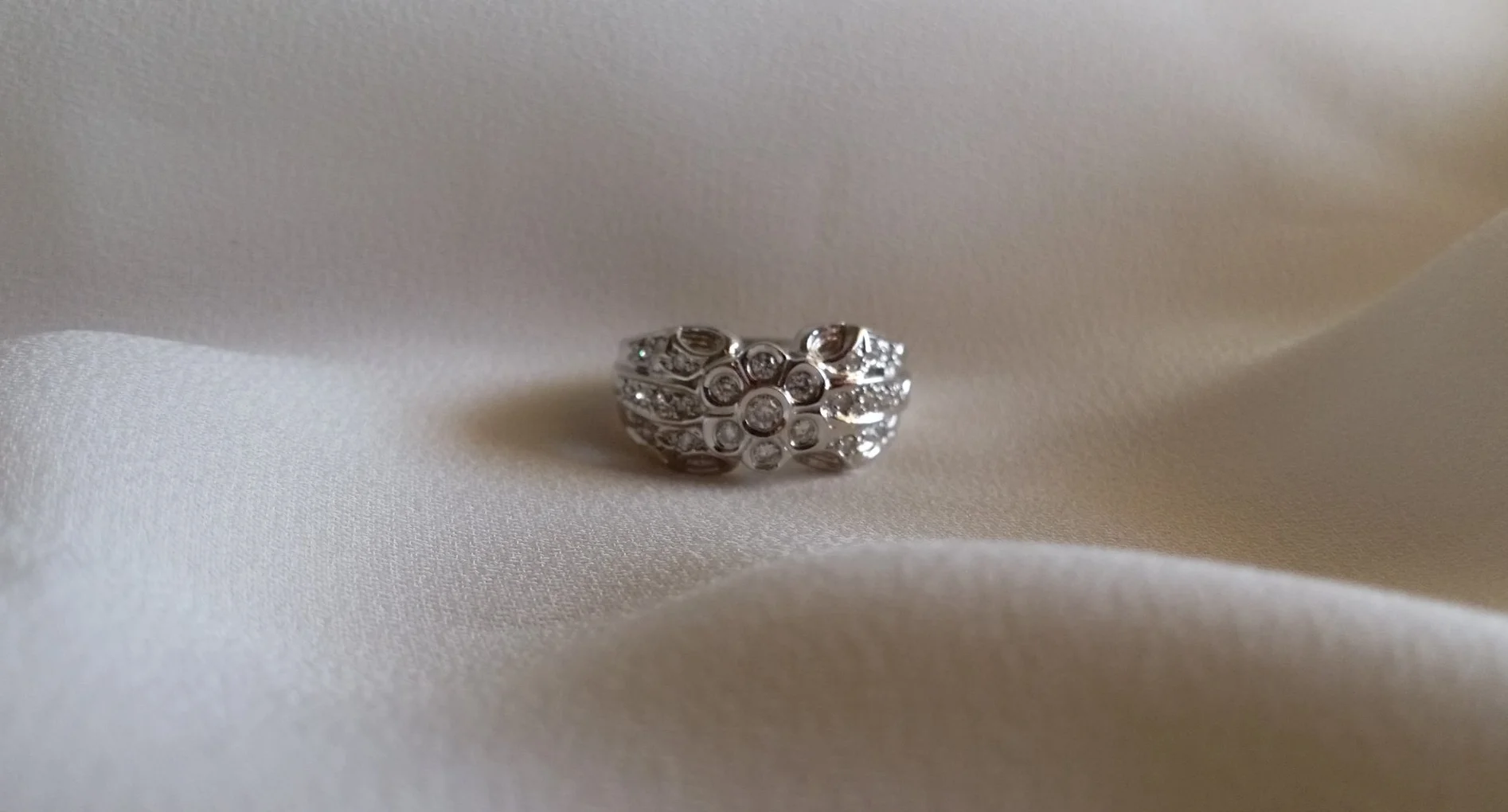 GGZ Diamond Flower Ring in White Gold About.jpg