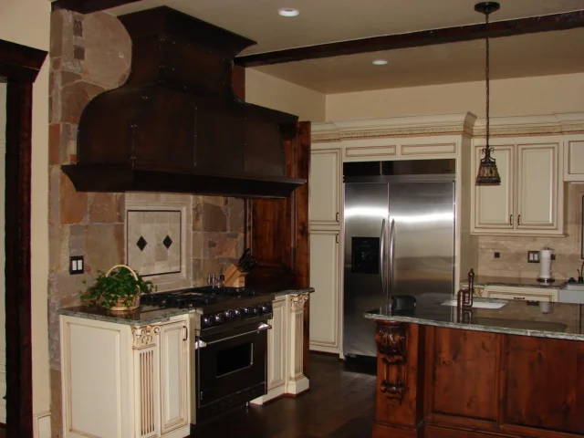  MT1 raised panels doors with a standard 1/2" overlay. Custom swooped style hood cover with a hammered copper covering. 