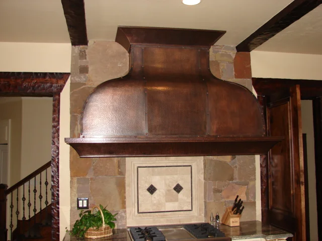  Custom swooped style hood cover with a hammered copper covering. 