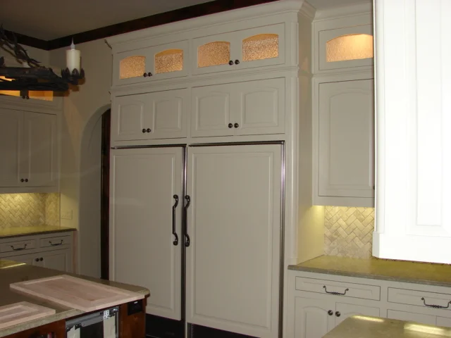  Eyebrow arched raised panel doors. Inset. 