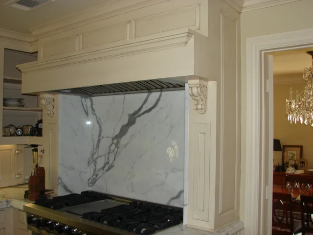  Mantle shelf style hood with spice pullouts. 