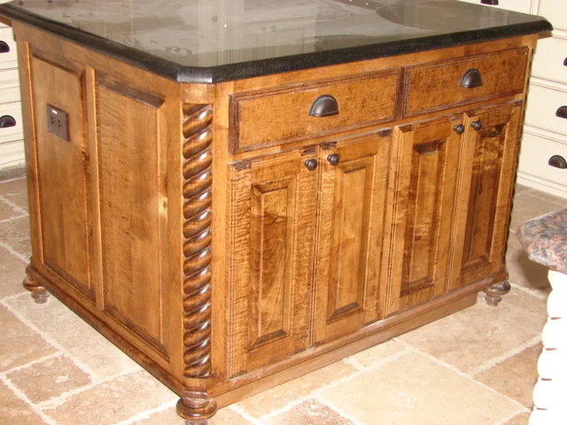  Maple, square raised panel doors with standard 1/2" overlay, rope round corner mould and bun feet. 