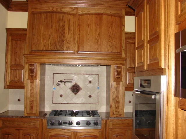  Red oak cabinets with eye brow 1/3 2/3 doors and a standard 1/2" overlay. Classic round corner moulding. 