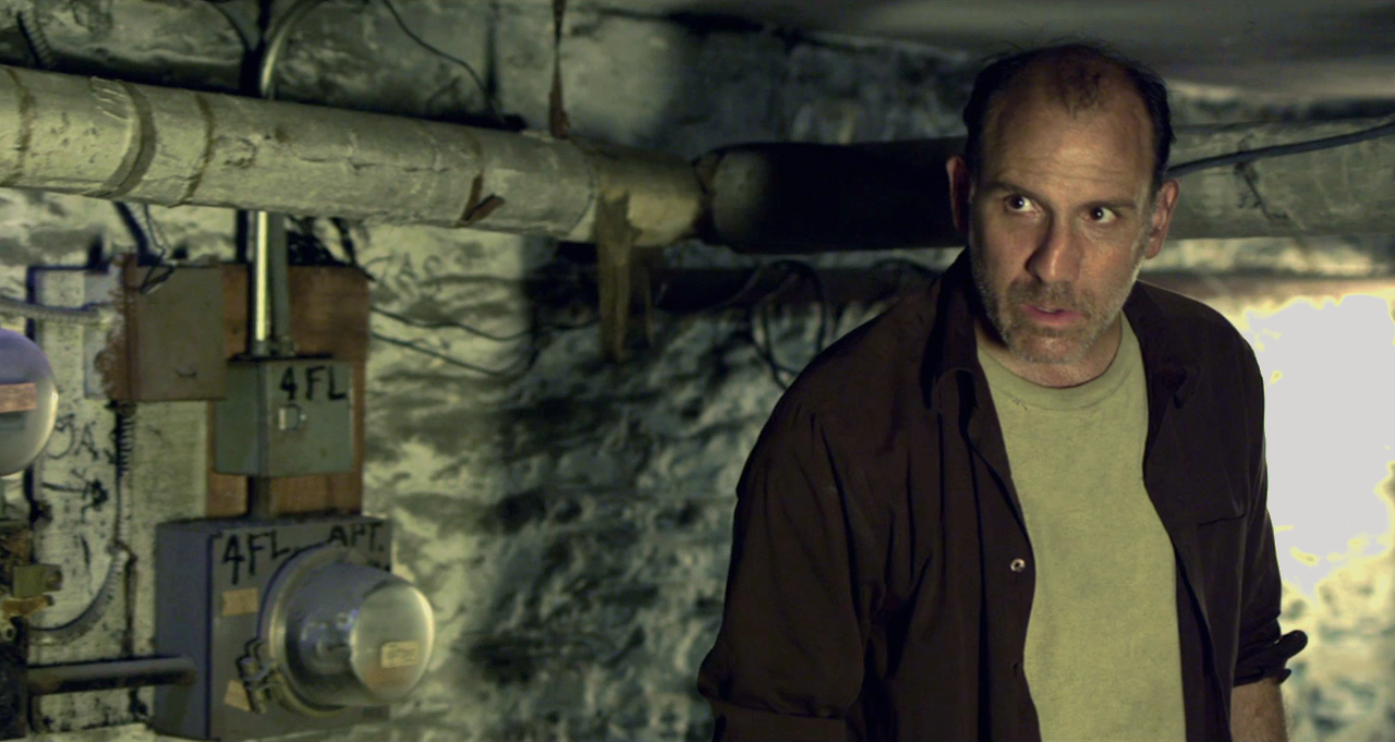 Nick Sandow as Travis