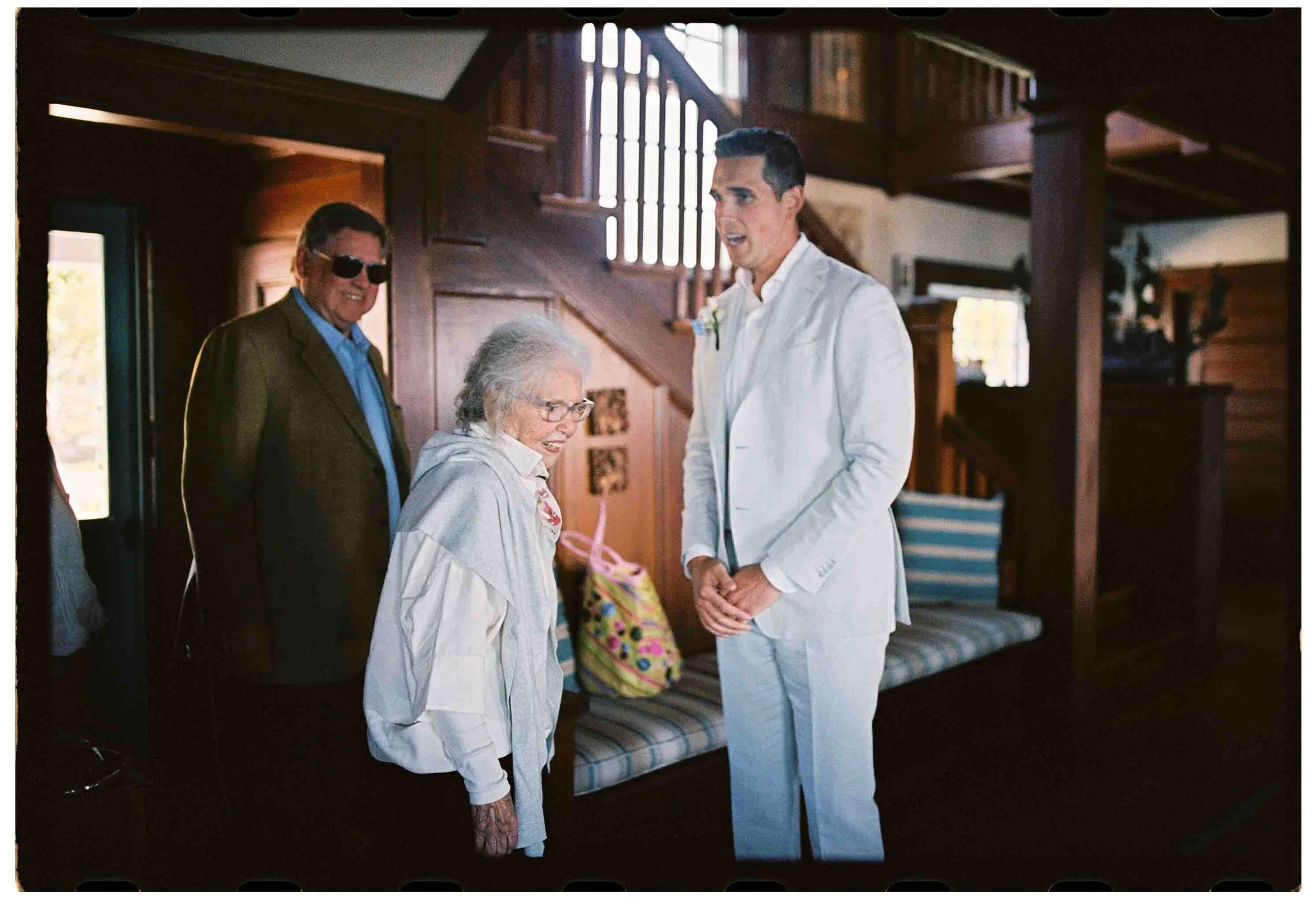 groom welcomes grandmother into home for wedding ceremony