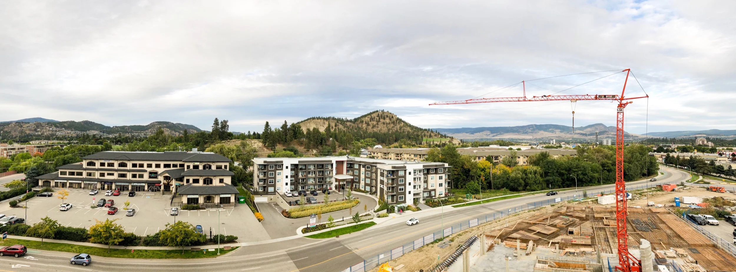 Beverly Kelowna site under construction with Enterprise Way below and Dilworth Mountain begins and Black Mountain in the distant background.