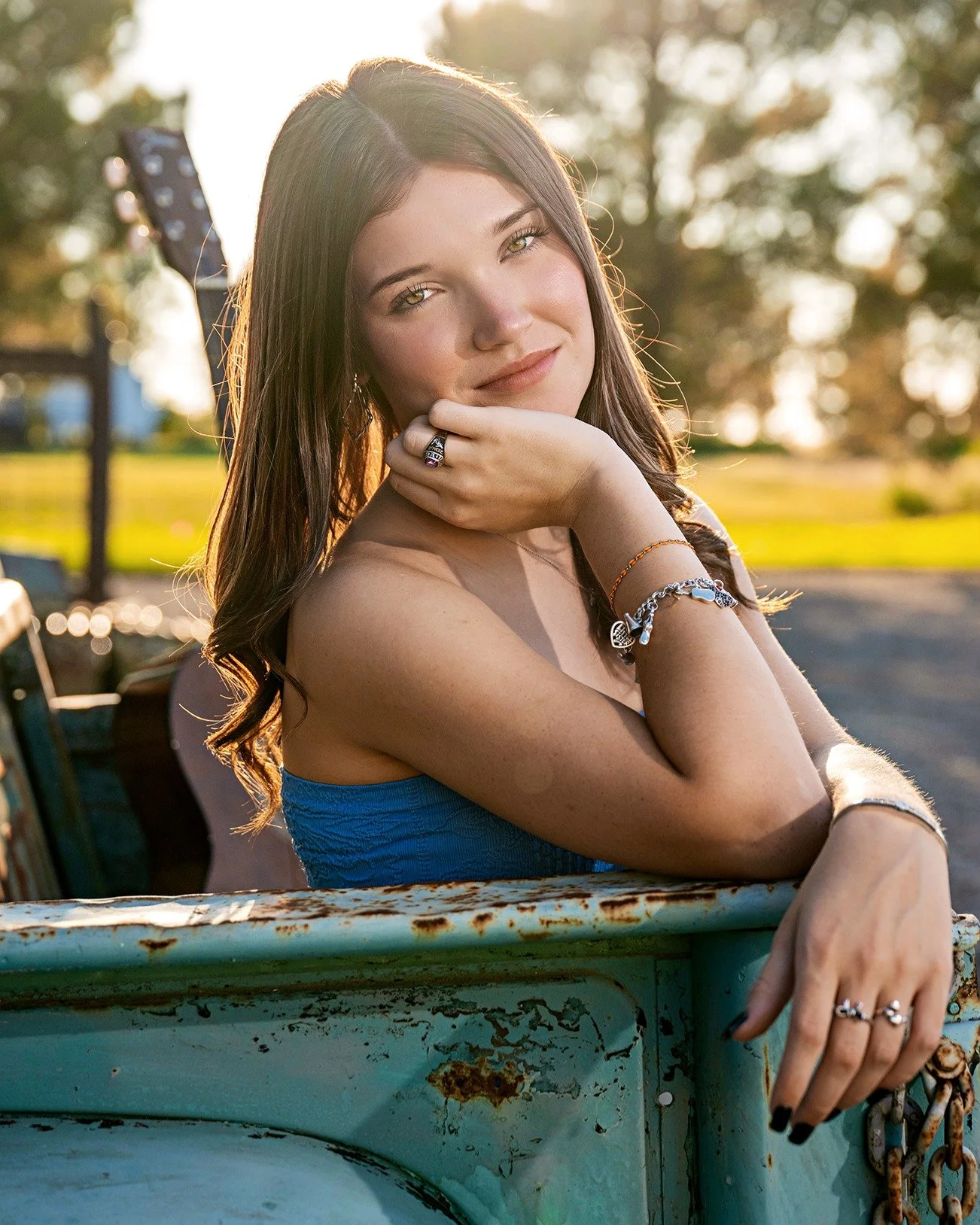 OH My Word! This image stopped me in my tracks and I just had to post it. So much to love about this image....this beauty, her class ring, her personalized JA bracelet, that golden light, her guitar in the background, and our old truck. Yesss!!! 
.
.