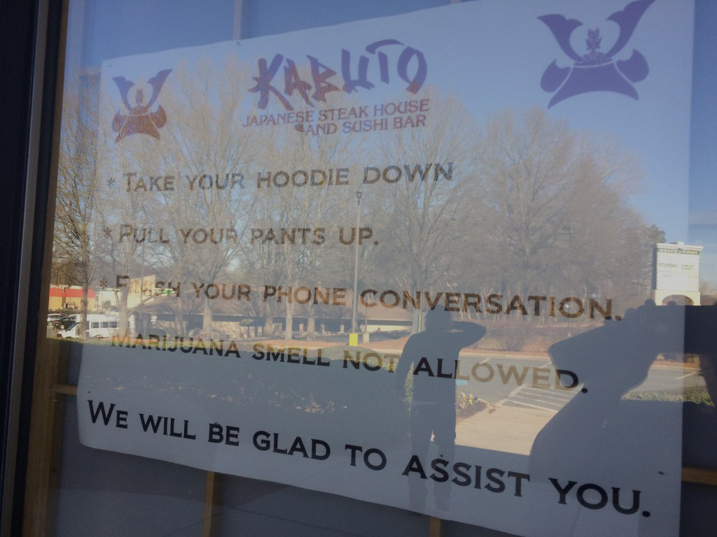 'Hoods down, pants up': Is this restaurant sign racist?