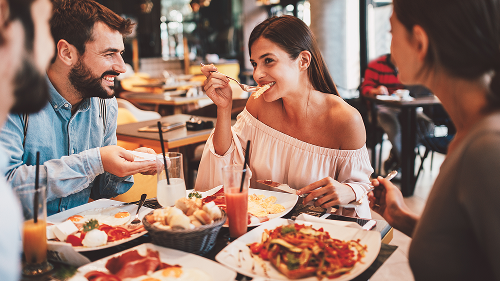 Group of friends enjoying a meal at a local Italian restaurants