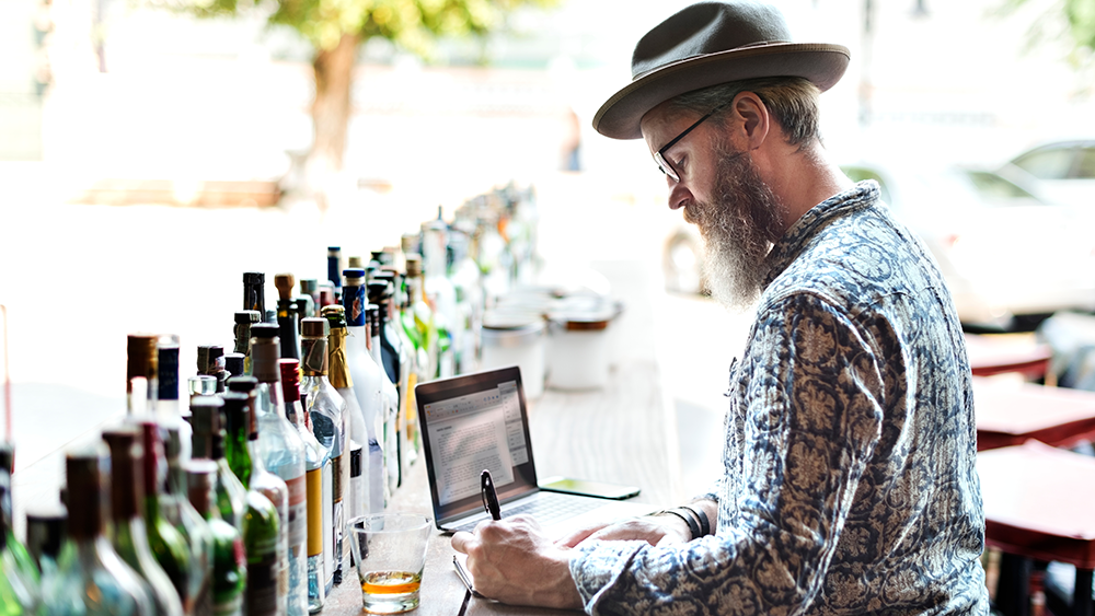Bar manager taking inventory notes