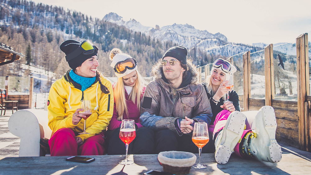 Friends having wine at a ski resort