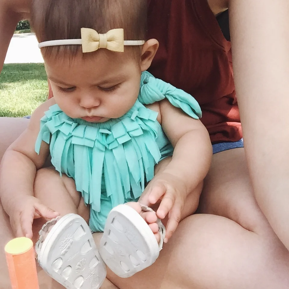 Fascinated by her shoes. Β