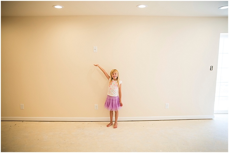 Maddie proudly displaying where the Tv will go for the viewing area!! 