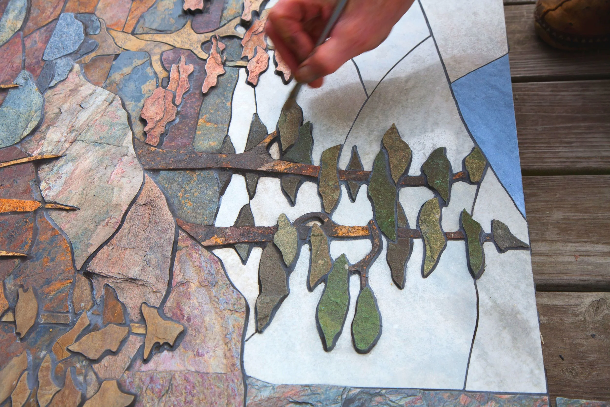 A stone mural in the making