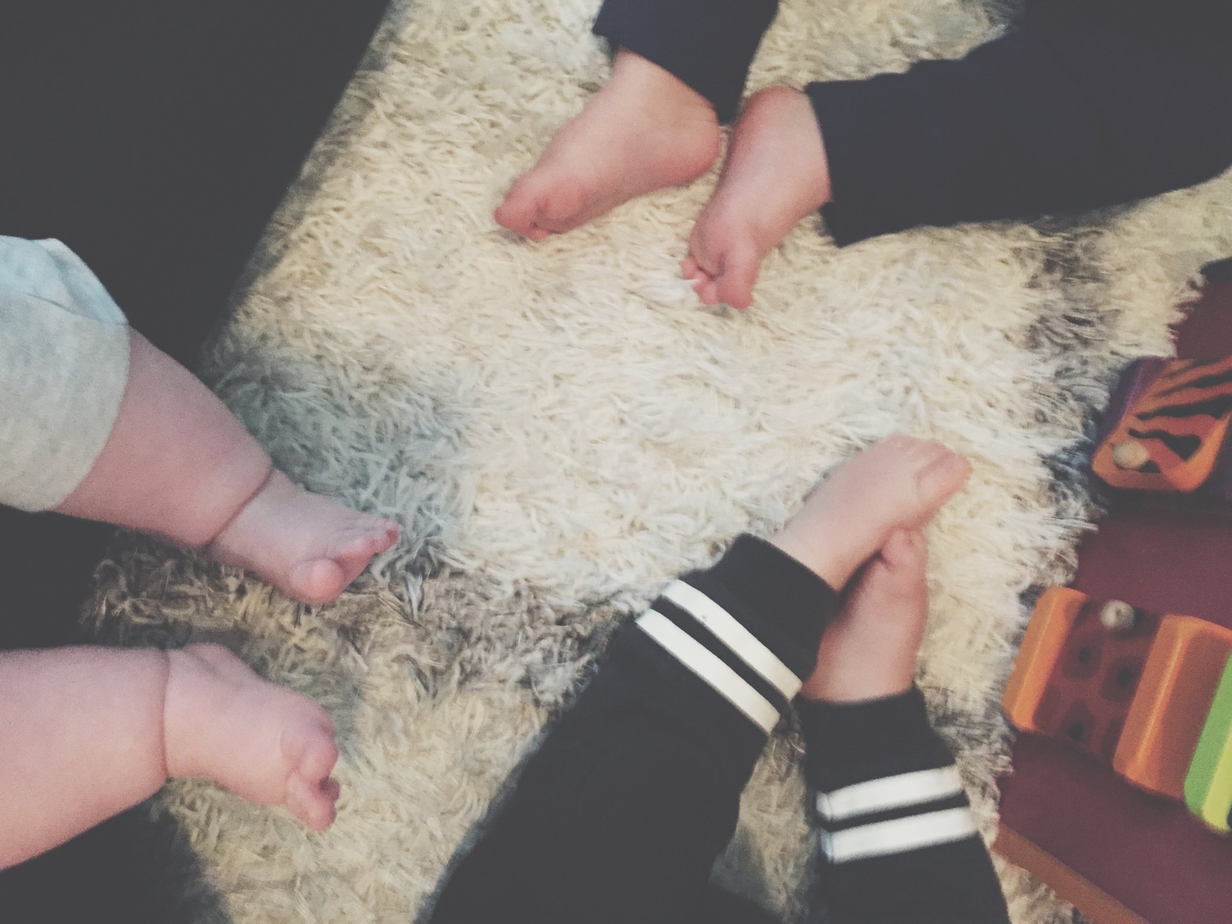 these tiny toes are 4 months, 10 months, and 1 year old.