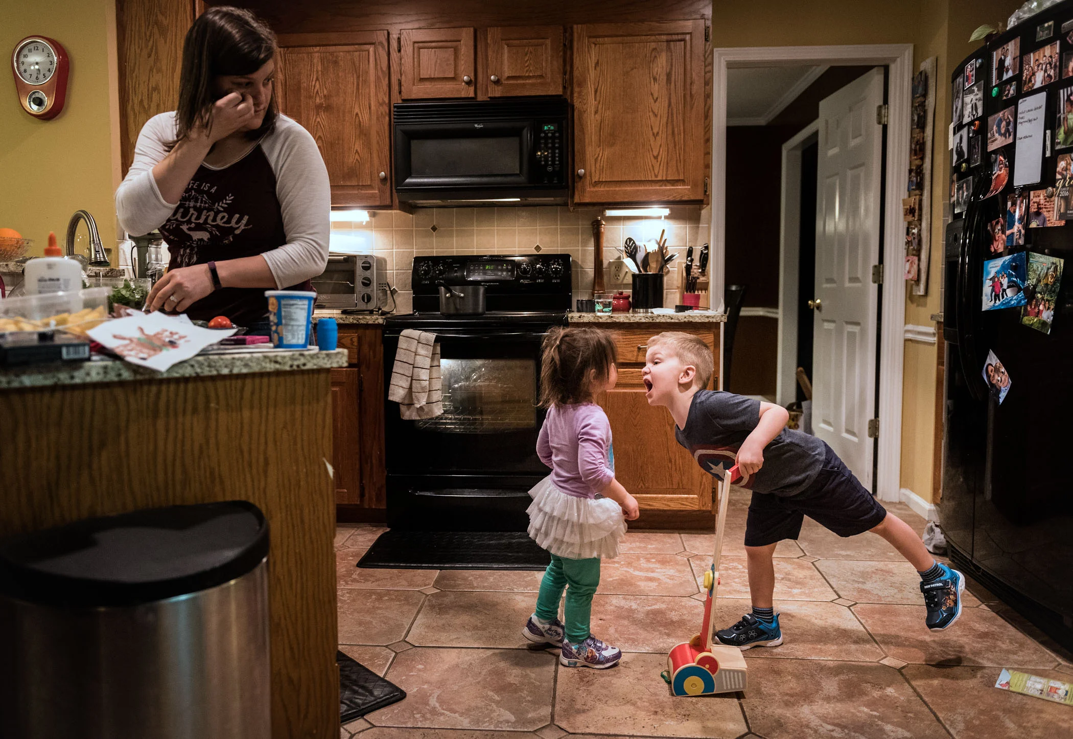  Levi Barkes shouts at his younger sister Cora Barkes after she tried to play with his toy vacuum while their mother Shana prepares dinner Sunday evening, Jan. 29, 2017 in their home in Hickory, N.C.  