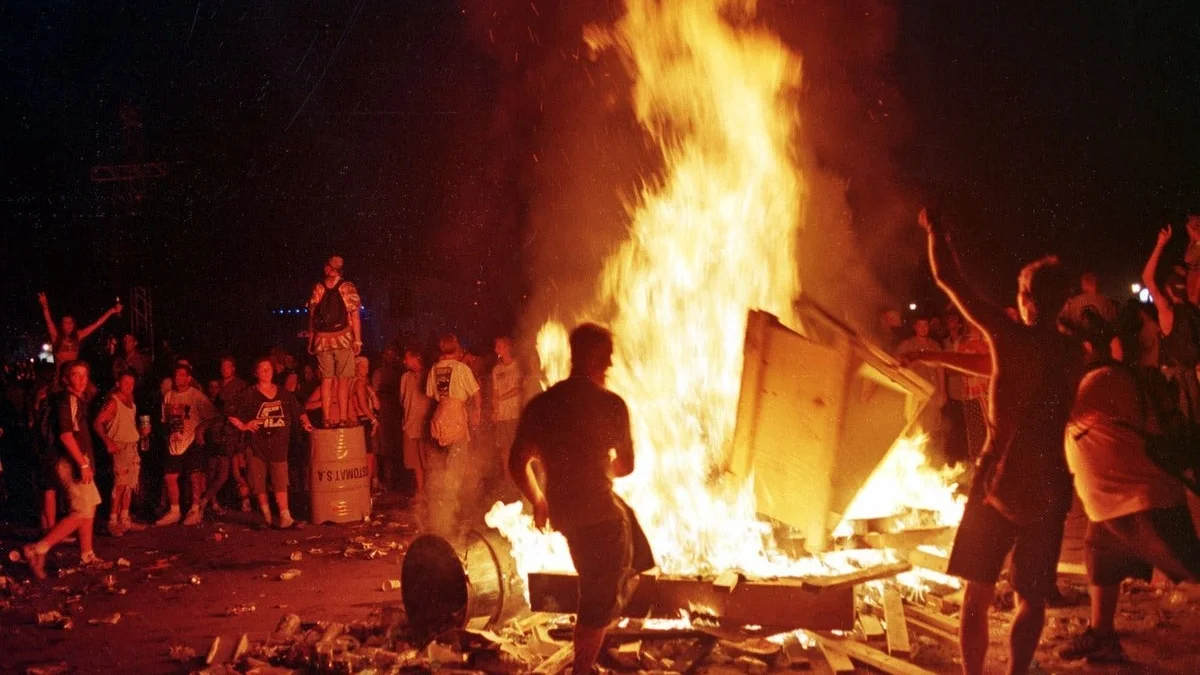 People Dancing Around a Bonfire at the Red Hot Chili Peppers Festival Closing Set
