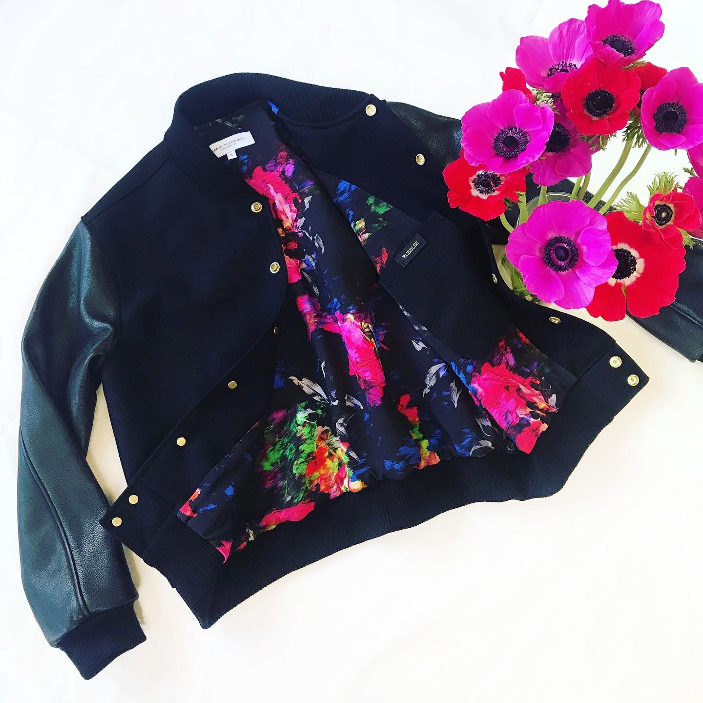  Black wool body, black leather sleeves, floral lining 