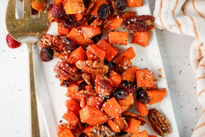 Maple Cayenne Sweet Potatoes with Cranberries and Candied Pecans