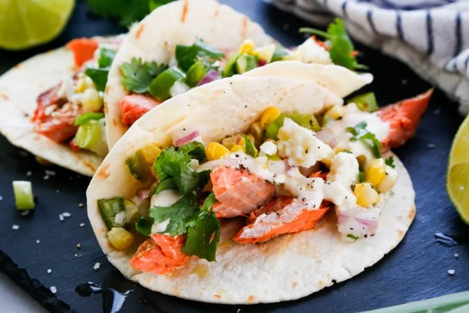 Salmon Tacos with with Grilled Corn and Jalapeño Salsa and a Lime Crema