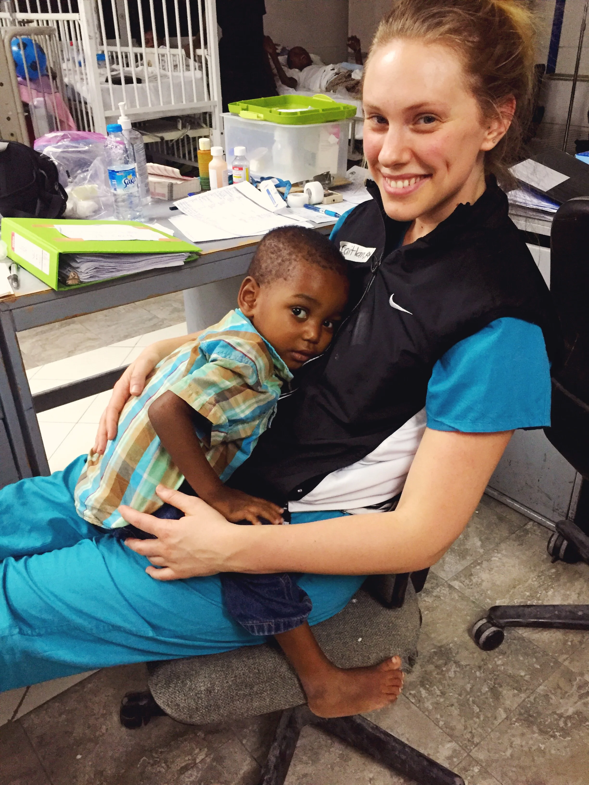 Cuddles. His mom dressed him so cute. My coworker said "looks like he's late for work" because he gets so dressed up in grown up hats. He is about to be discharged in this picture but mom had to pay the bill before they could leave.