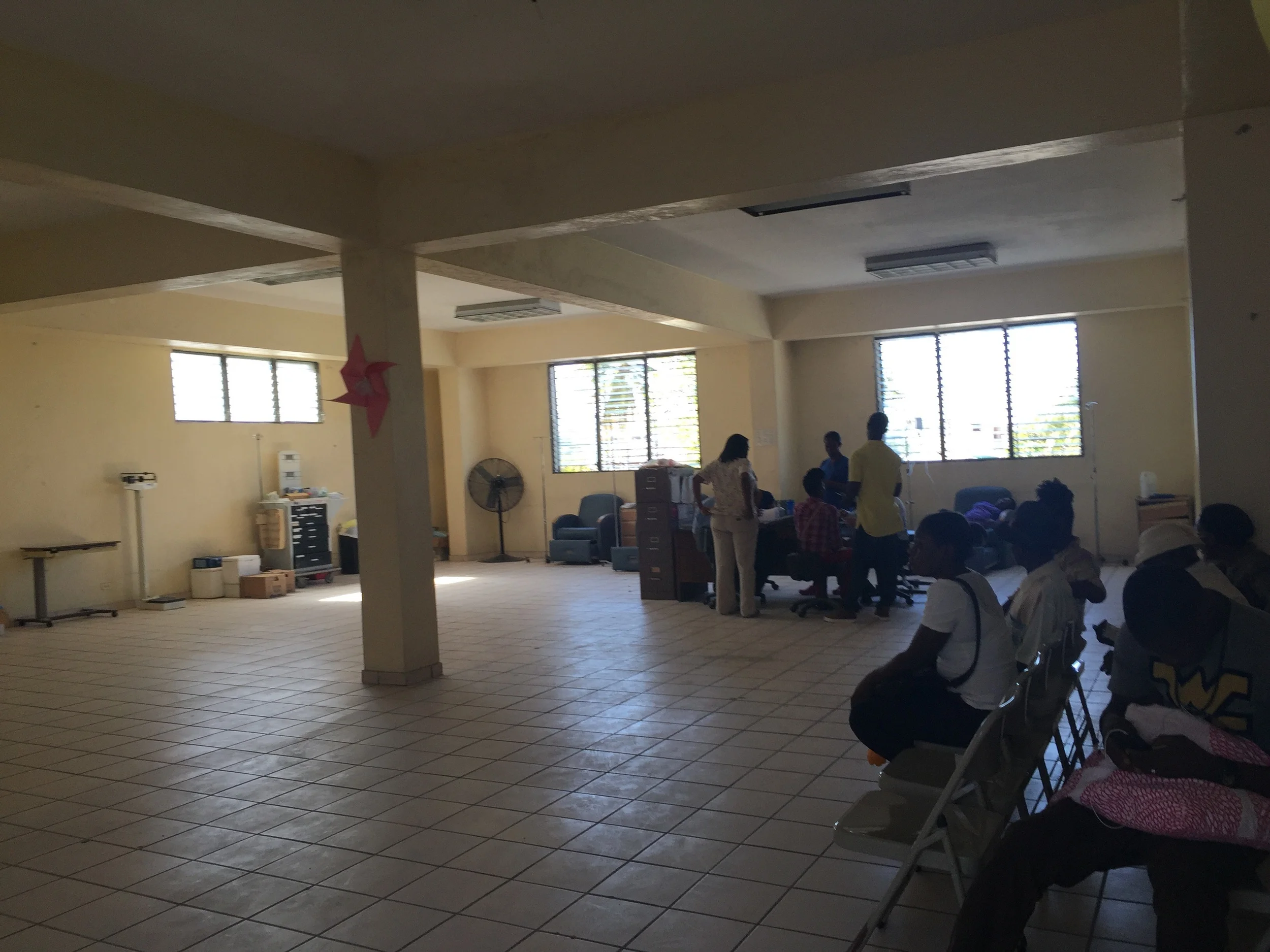 The infusion room. Four chairs, no pumps, no pillows. The chairs are lined up against those back 2 windows.