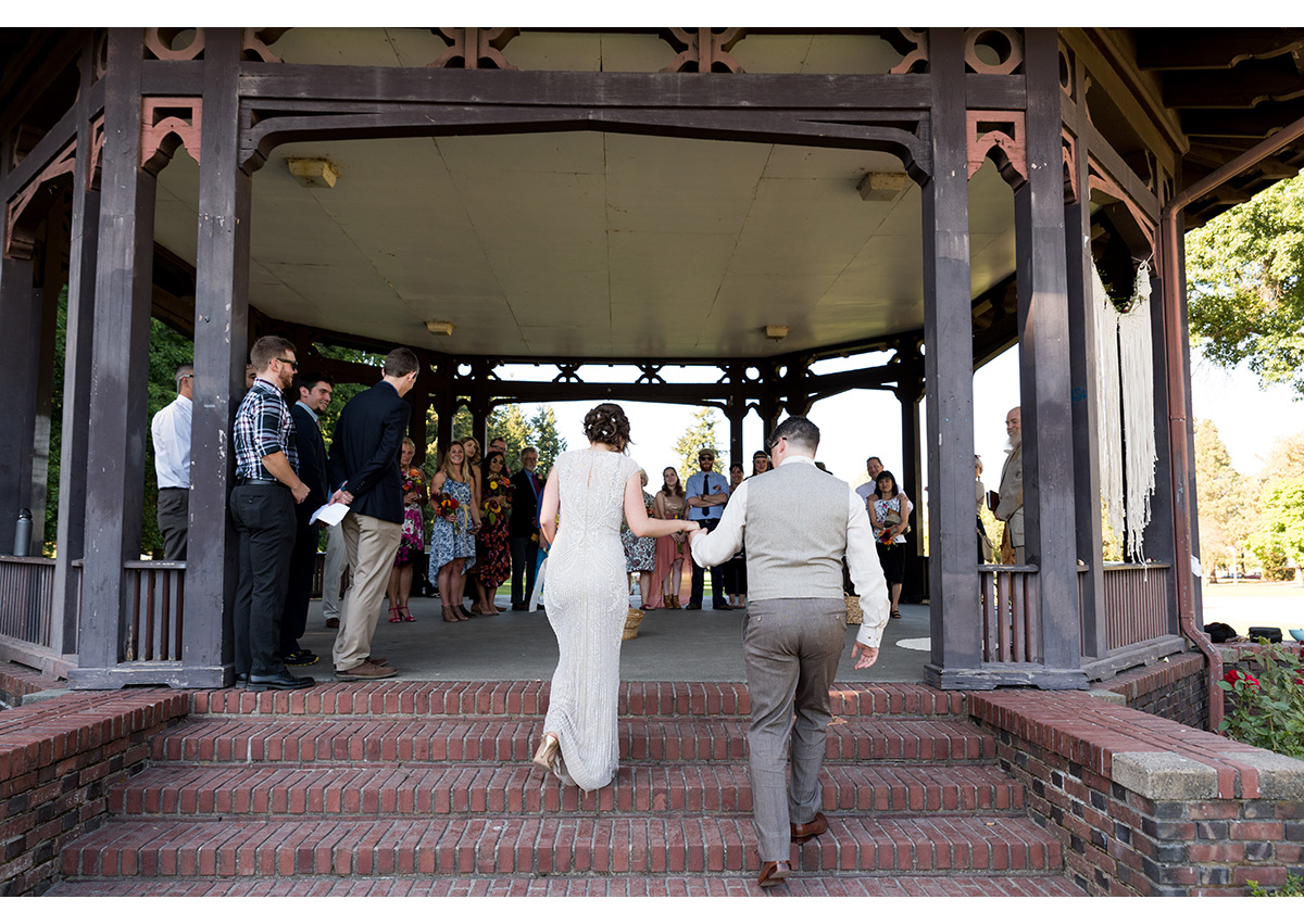 Bride and Groom walking up ceremony steps at Peninsula Park