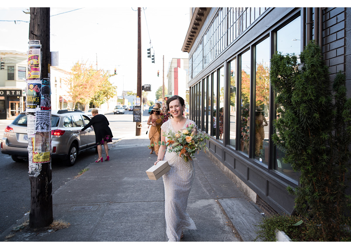 Bride walking down Portland street to wedding ceremony