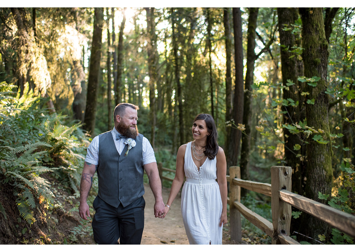 Bride and Groom walking on wildwood trail in Forest Park