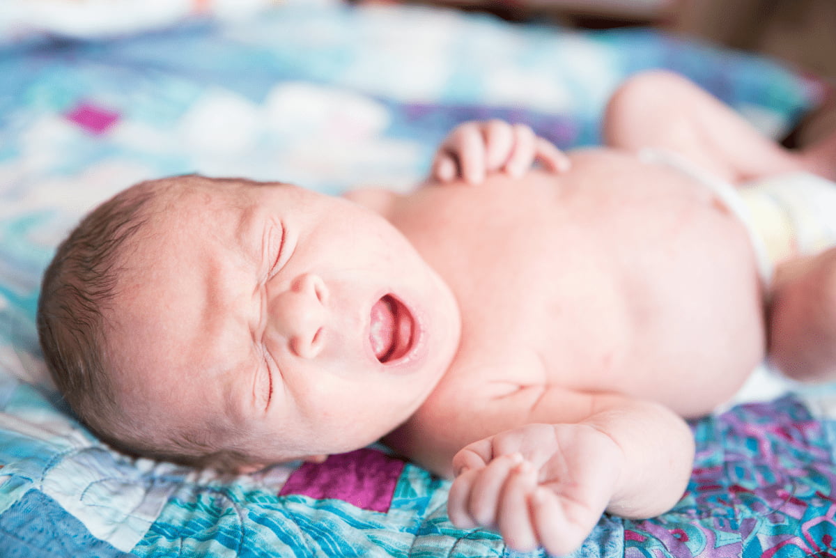 Newborn baby yawning 