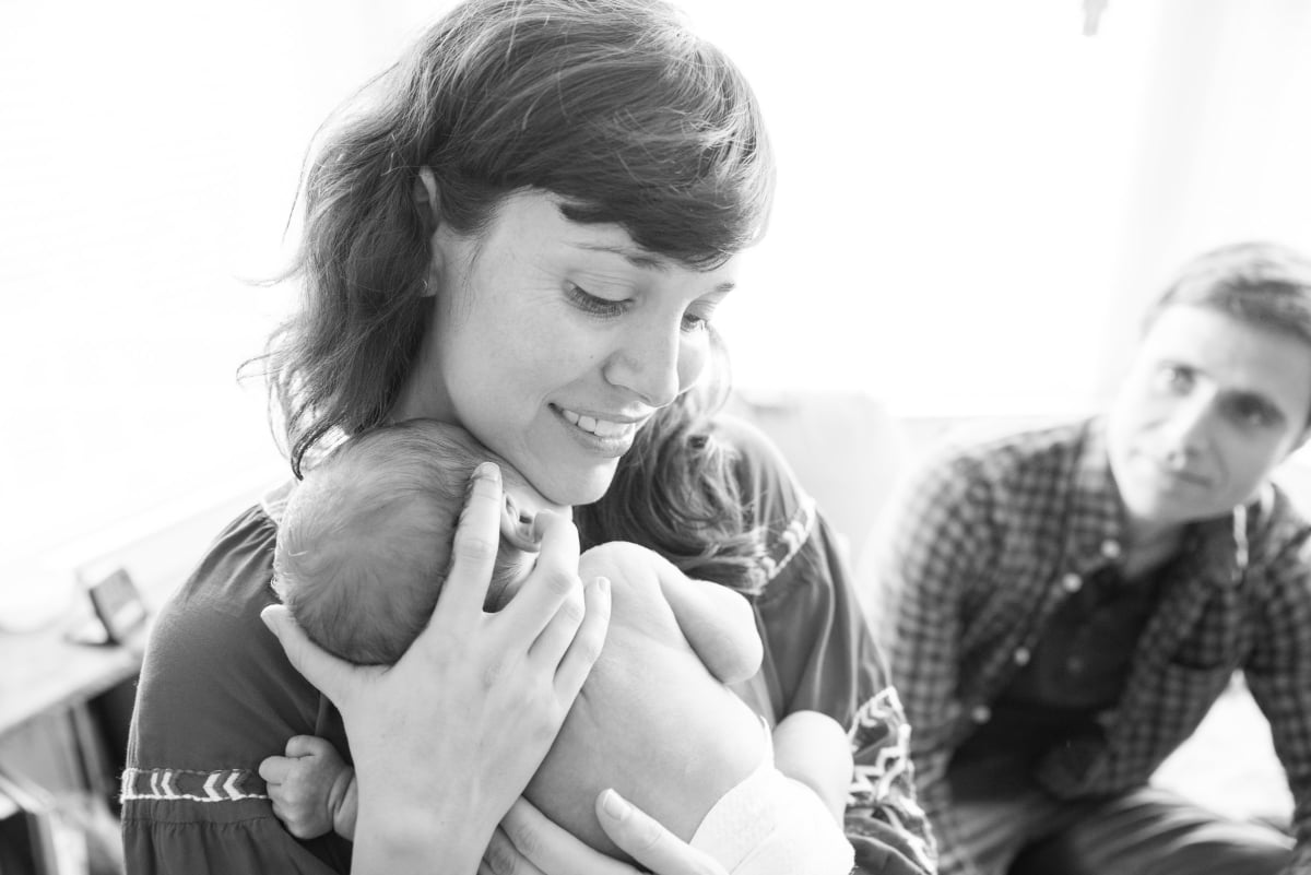 Black and white of mother holding baby