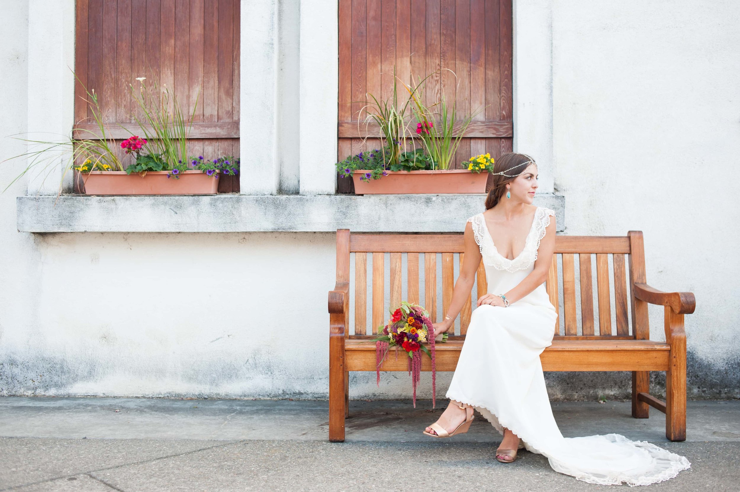 Portrait of bride siting on bench alone