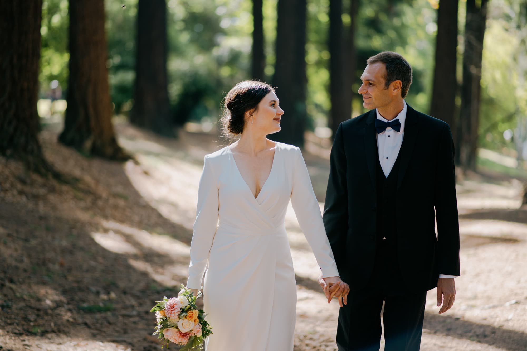 Photo of bride and groom walking in Sellwood Park in Portland