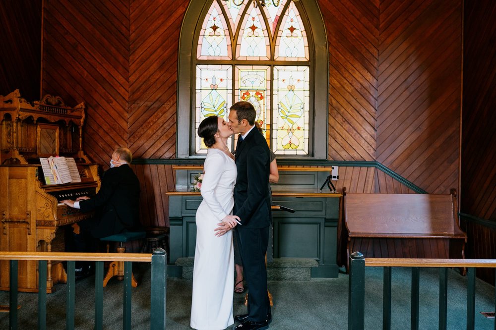 Bride and groom kiss at end of ceremony