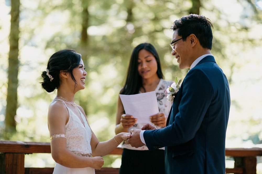 Bride and Groom exchanging rings on Redwood Deck