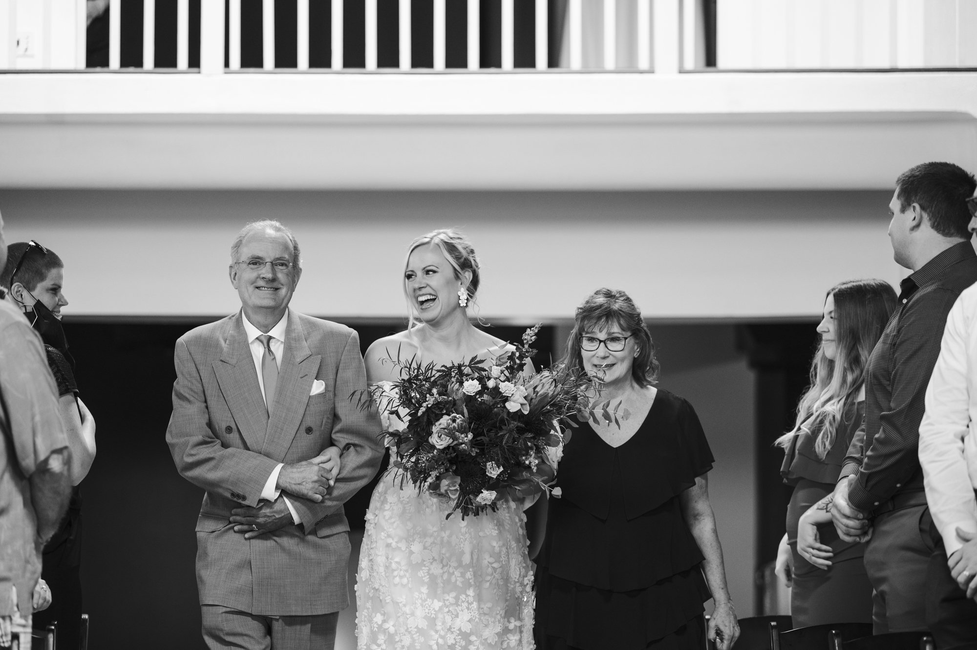 Father and Mother walking bride down aisle at The Evergreen