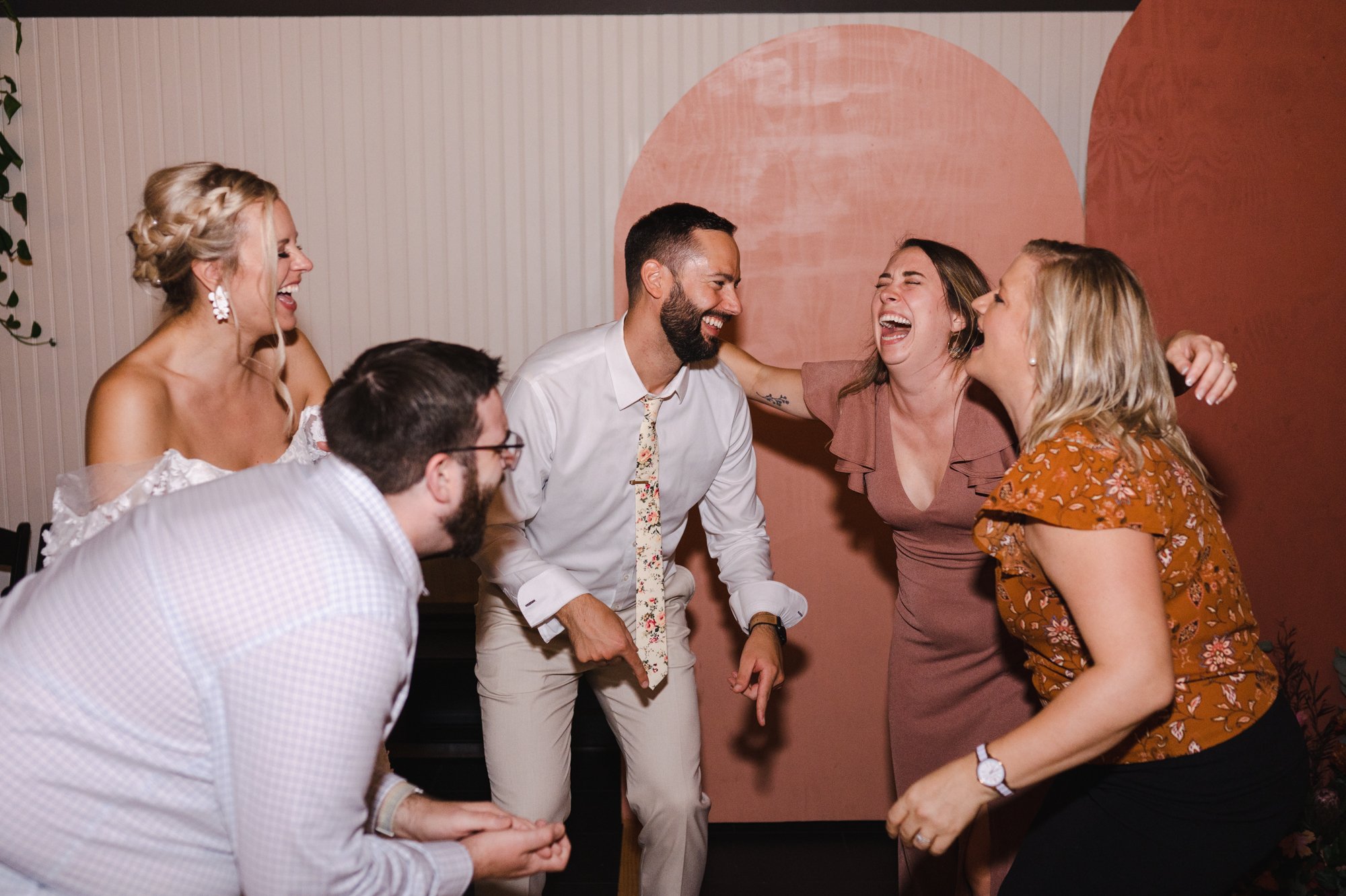Candid of Groom and wedding guests dancing