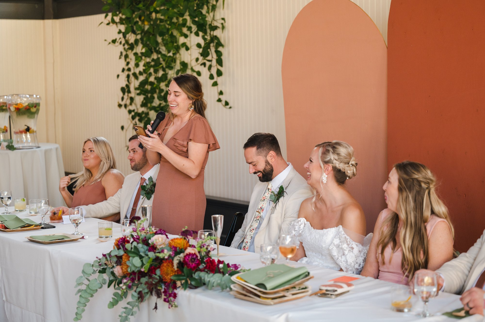Bridesmaid giving toast during reception
