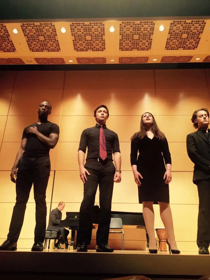 Michaela singing a solo line in "Someone Somewhere Tonight" with her collegiate a cappella ensemble, VocaLibre, in their Spring 2016 concert