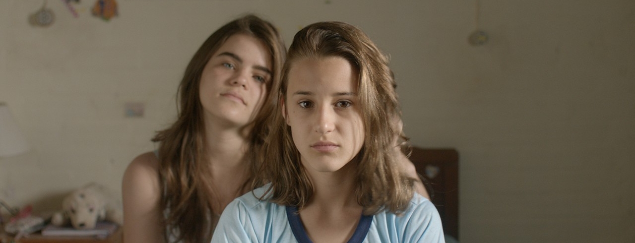 TWO IRENES / AS DUAS IRENES (Fabio Meira, Brazil, 2017, 89 min. In Portuguese with English subtitles) Q&A with director Fabio Meira By chance, Brazilian teenager Irene (newcomer Priscila Bittencourt, in an assured performance) discovers that there is another 13-year-old Irene living in the same town. Curiously, she observes the confident, cheerful girl who lives alone with her mother. She is fascinated by this other world beyond the bounds of her own well-to-do and traditional family. This other Irene seems free. Soon the two girls, apparently so different from each other, are spending every day together, meeting up with boys in the cinema or going to the lake. When they start talking about their fathers, they notice that they have more in common than they had thought. Winner of the Best First Feature and Best Cinematography awards at the Guadalajara Film Festival, this debut feature by Fabio Meira is an exquisite mosaic that weaves a wonderfully delicate web around questions of identity, true friendship, and the first steps towards adulthood. Monday, November 5, 7:15pm