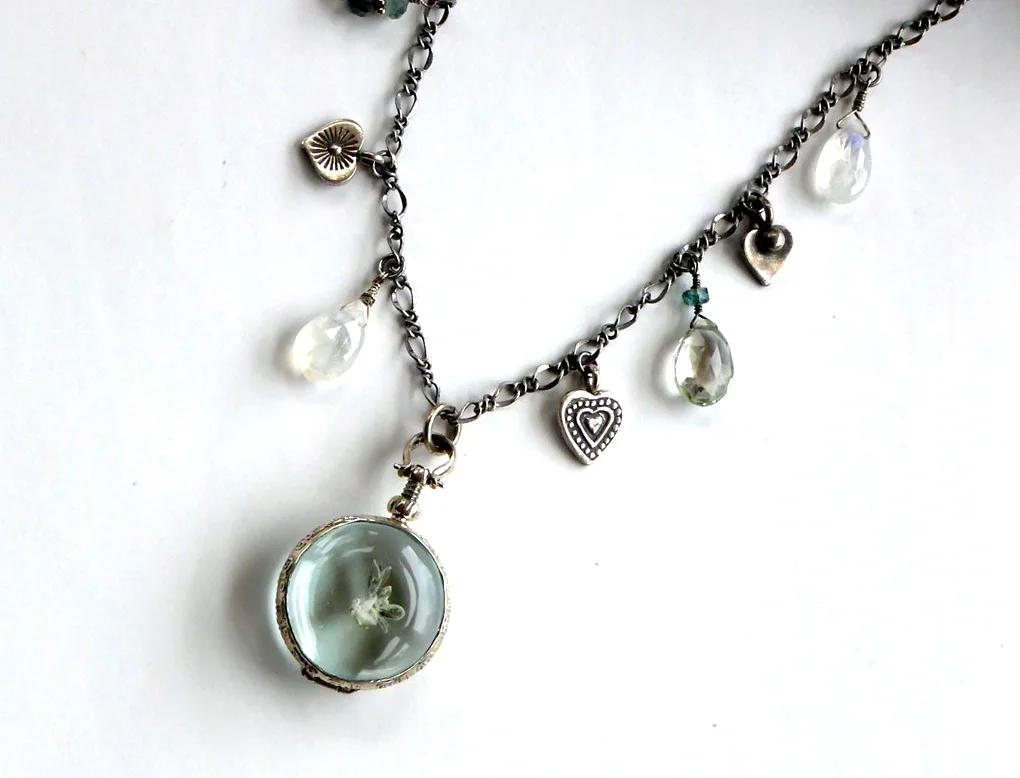 Keepsake locket necklace with sterling heart charms