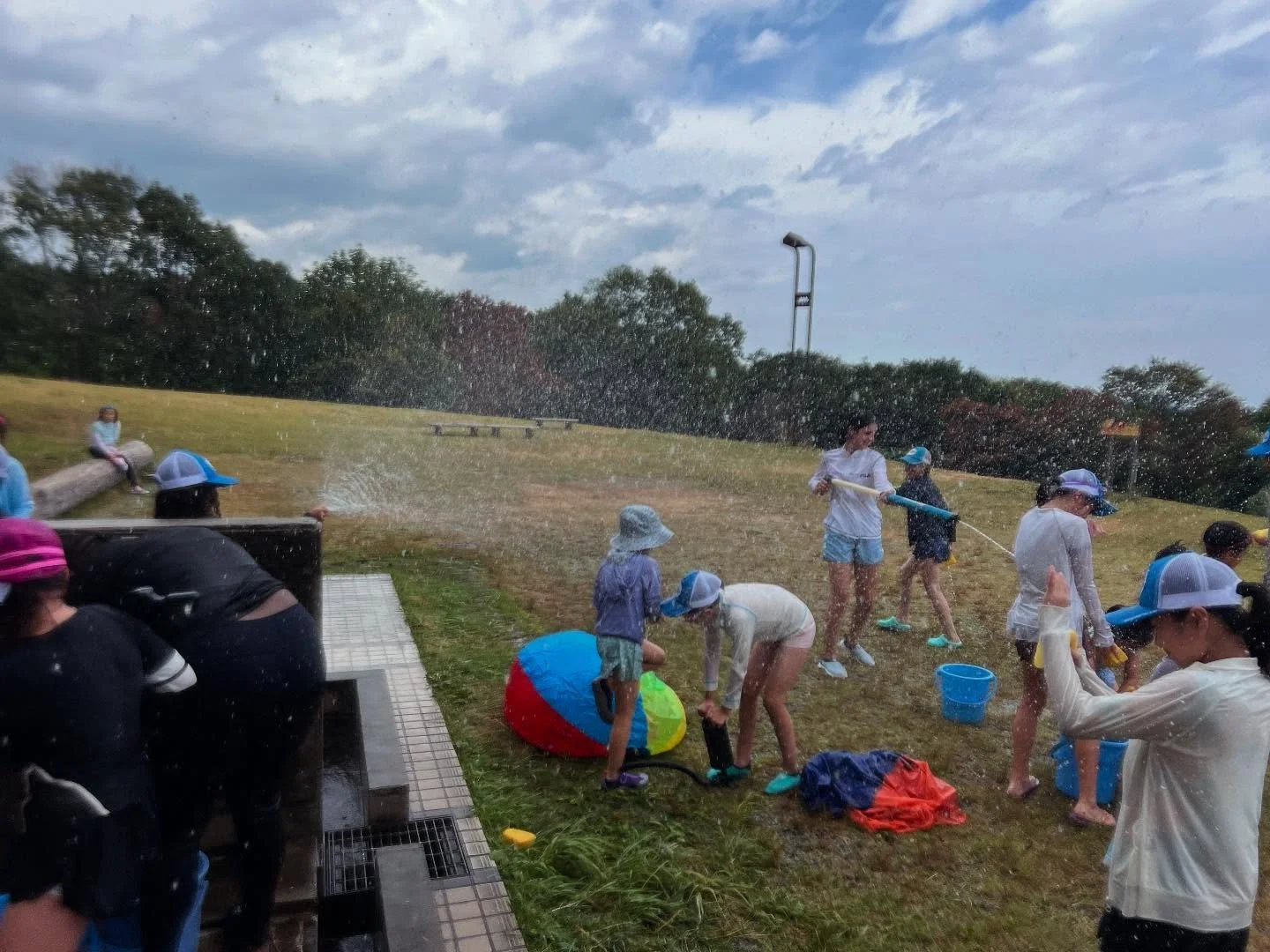 Myoko camp water play. We made it and it was a beautiful hot sunny day. The perfect recipe to cool down! The kids love spraying their counsellors too! #waterplay #splashpad #summer #summercamp #englishcamp #hot #cooloff #kidscamp #japan #niigata #mou