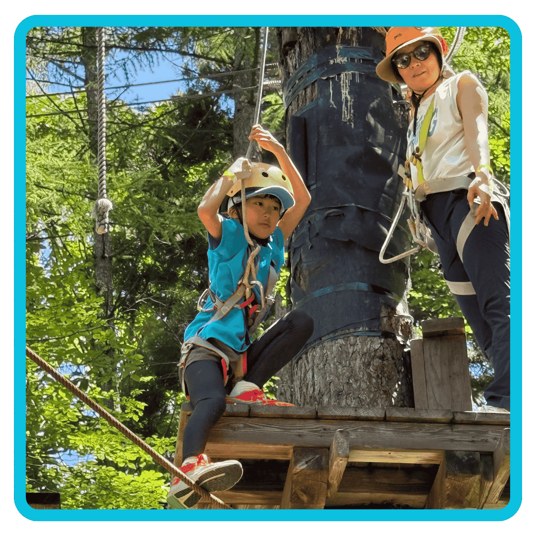 Family enjoying a zip line course at Summer Camp