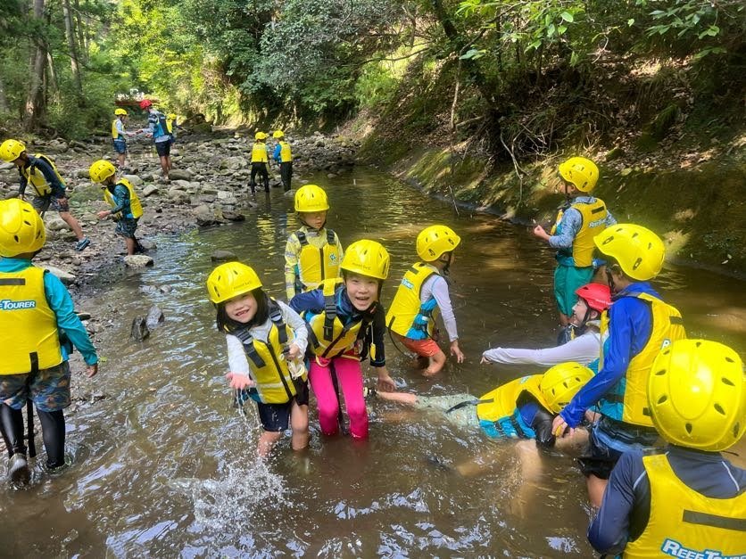 kids exploring in a river catching fish and crabs at Summer Camp