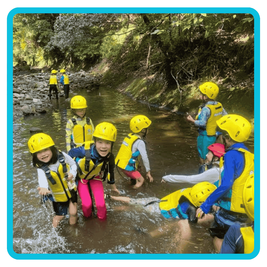 kids exploring in the river at Chiba Summer English Camp