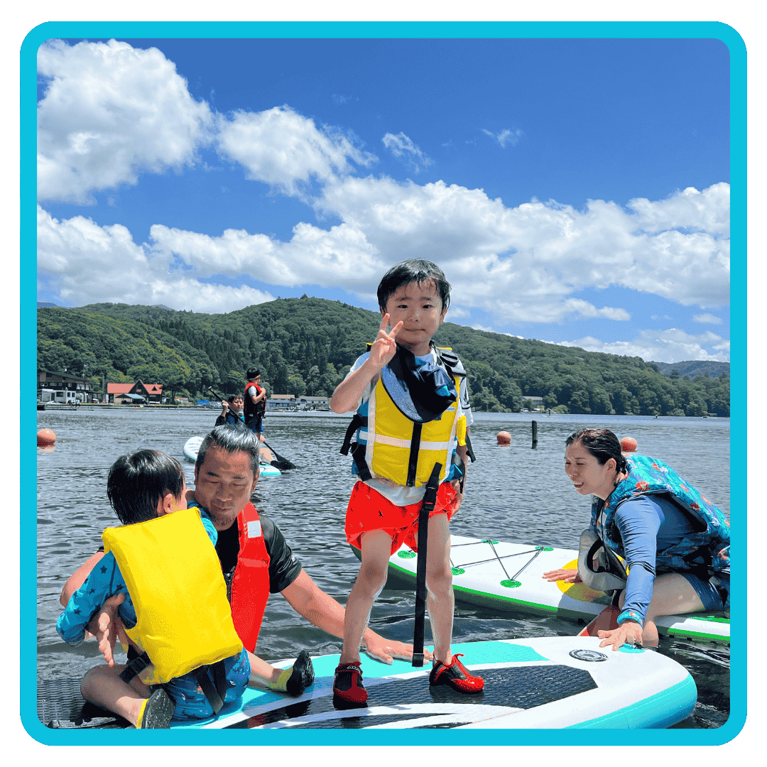 Family enjoying some fun in the sun while paddling on a lake