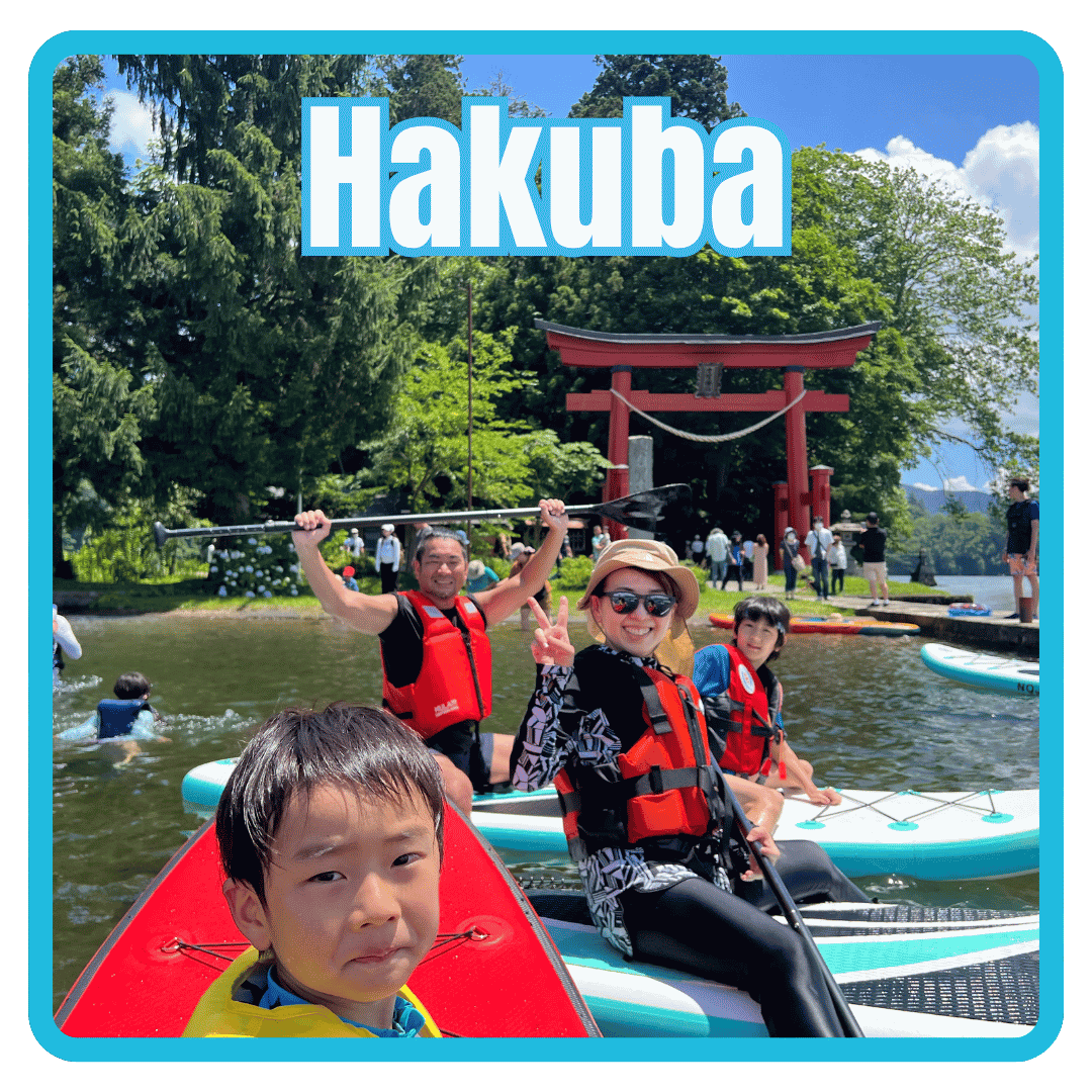 Families enjoying a SUP tour on a beautiful lake in Nagano