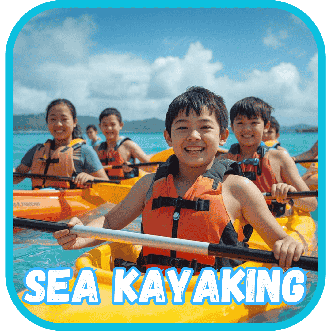 Kids on a sea kayak tour in Okinawa at Summer Camp