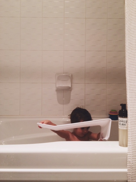 Theo modelling the bath sling with K'Pure Naturals always within reach.